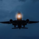 an airplane flying at night