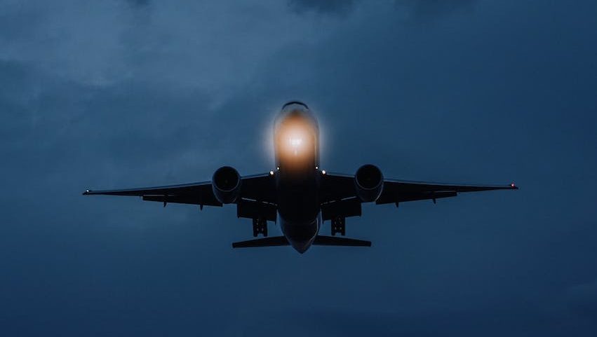 an airplane flying at night