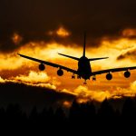 airplane silhouette on air during sunset